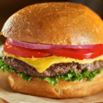 hamburger with tomato, onion, lettuce, and cheese